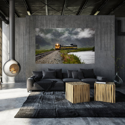 modern contemporary black themed industrial living room with train art from alaska hanging behind a dark grey couch