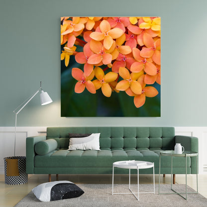 green color palette living space featuring large art of orange coral peach colored botanical flowers on the wall