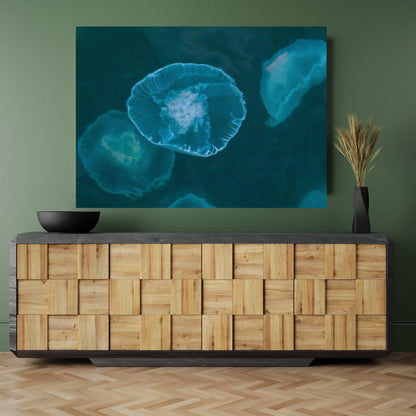 Neutral bamboo cabinet in green room featuring large wall art decor of teal jellyfish in alaska