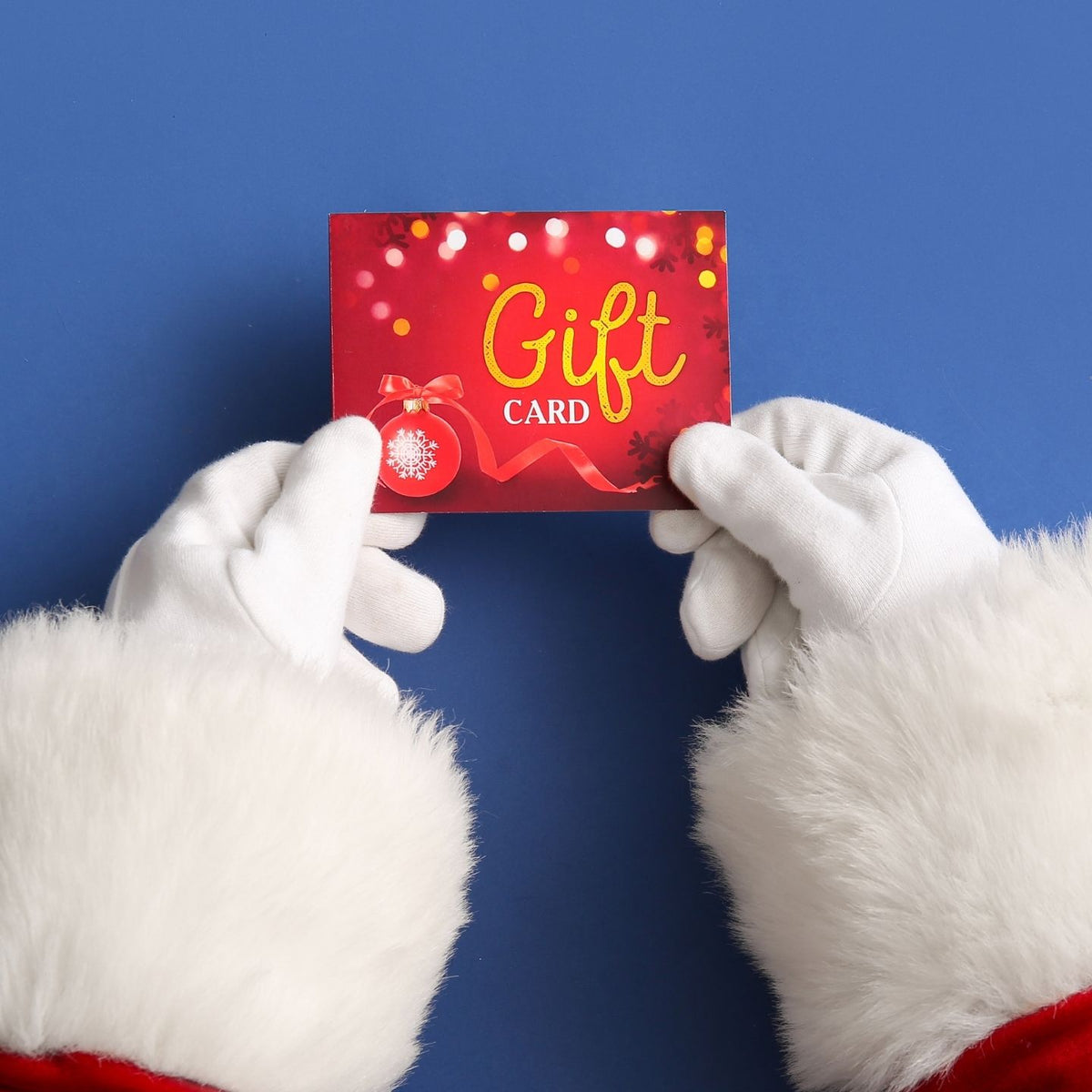 Santa showing a gift card