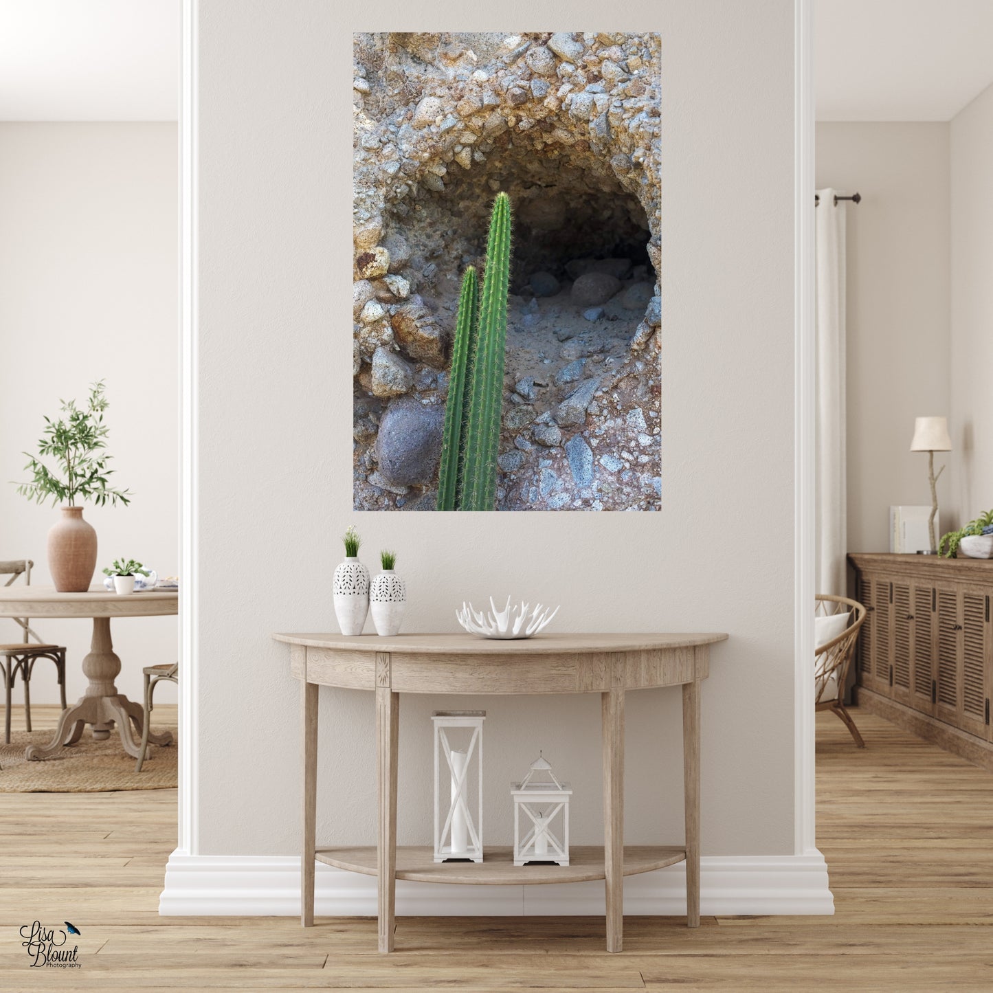 large rock formation picture displayed on hall wall above side table
