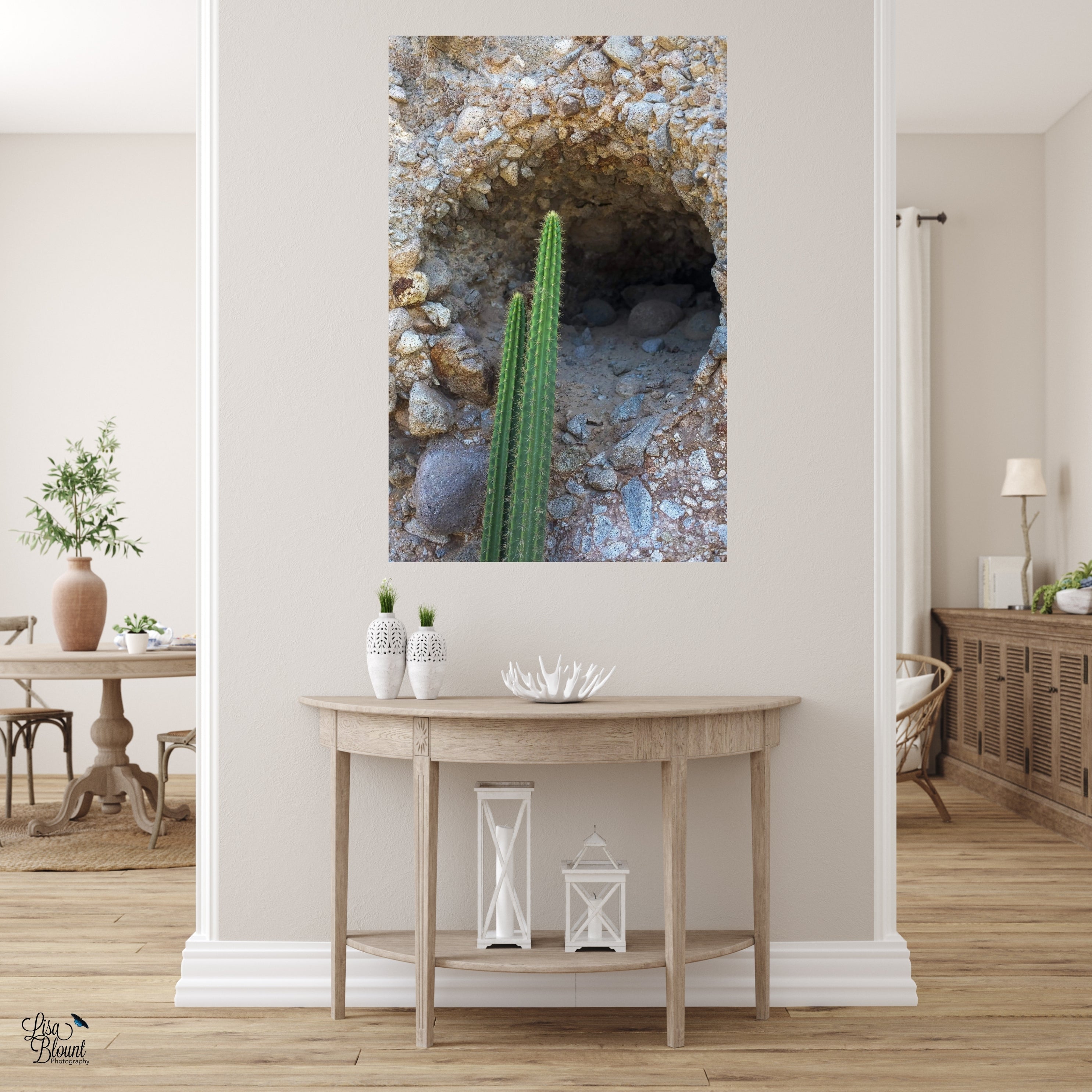 Unique nature-inspired wall art with cactus and rock opening displayed on hall wall above side table