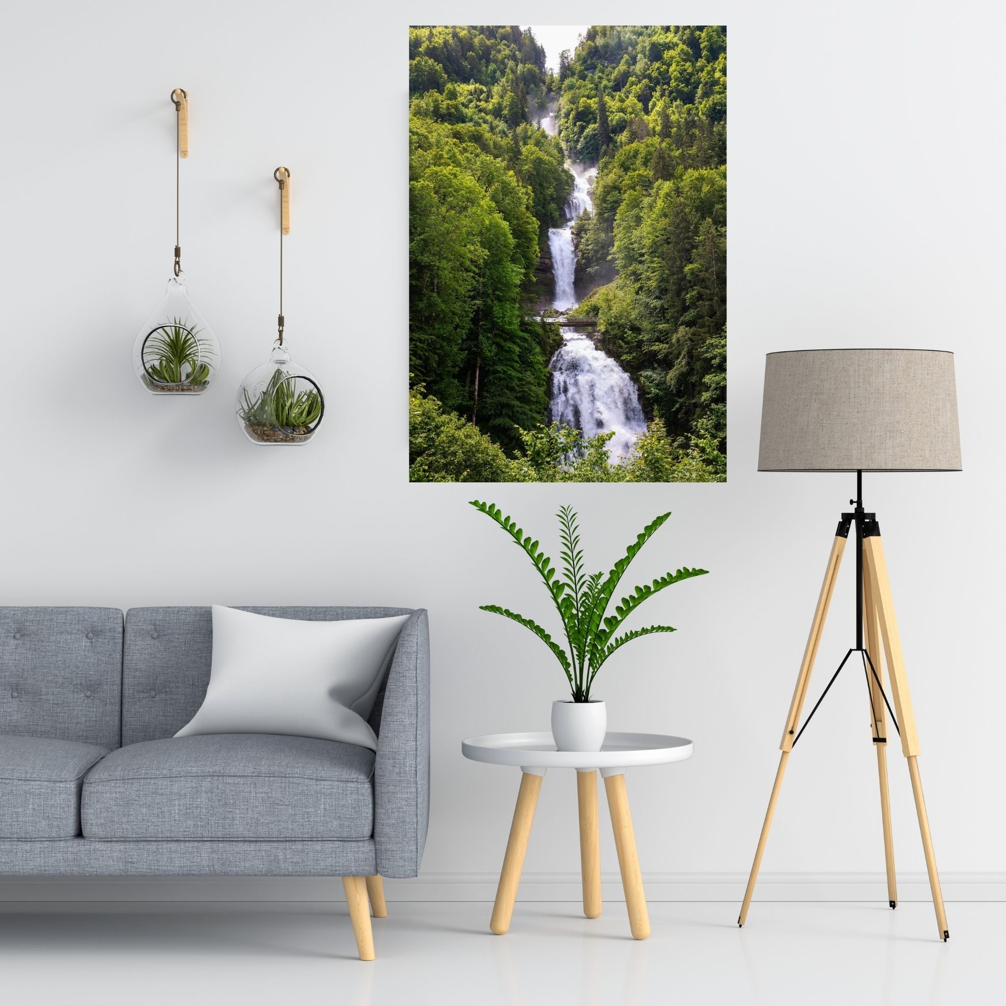 Upper Giessbach Falls on Lake Brienz in Interlaken Switzerland - large art on a white wall with grey couch and green plants