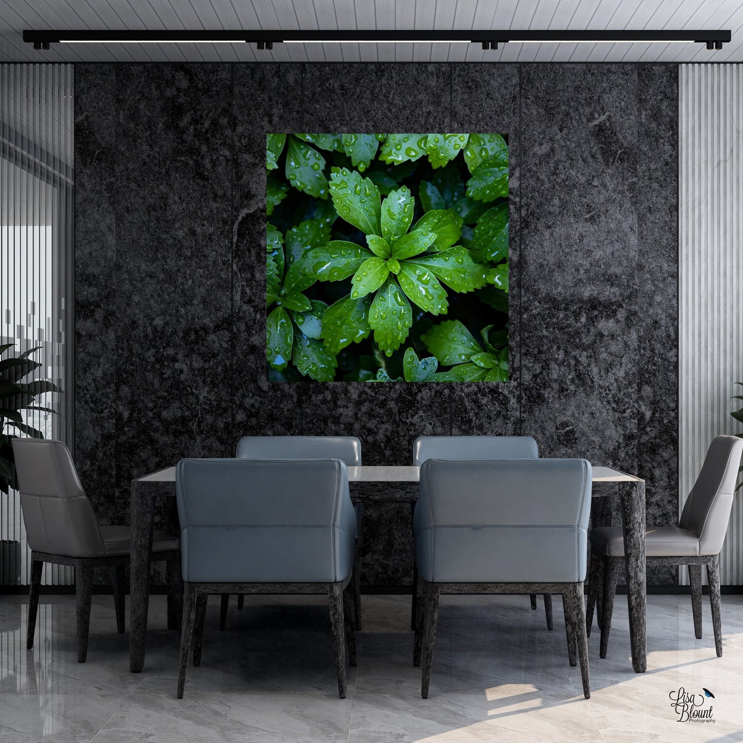 bright green art of leaves with raindrops as the focal point on dark gray conference room wall