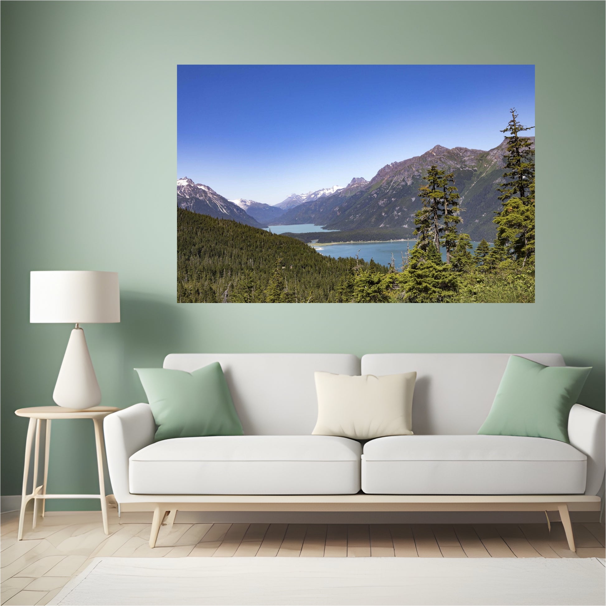 mint green living area room with a large art piece of haines alaska's chilkoot lake photography wall decor