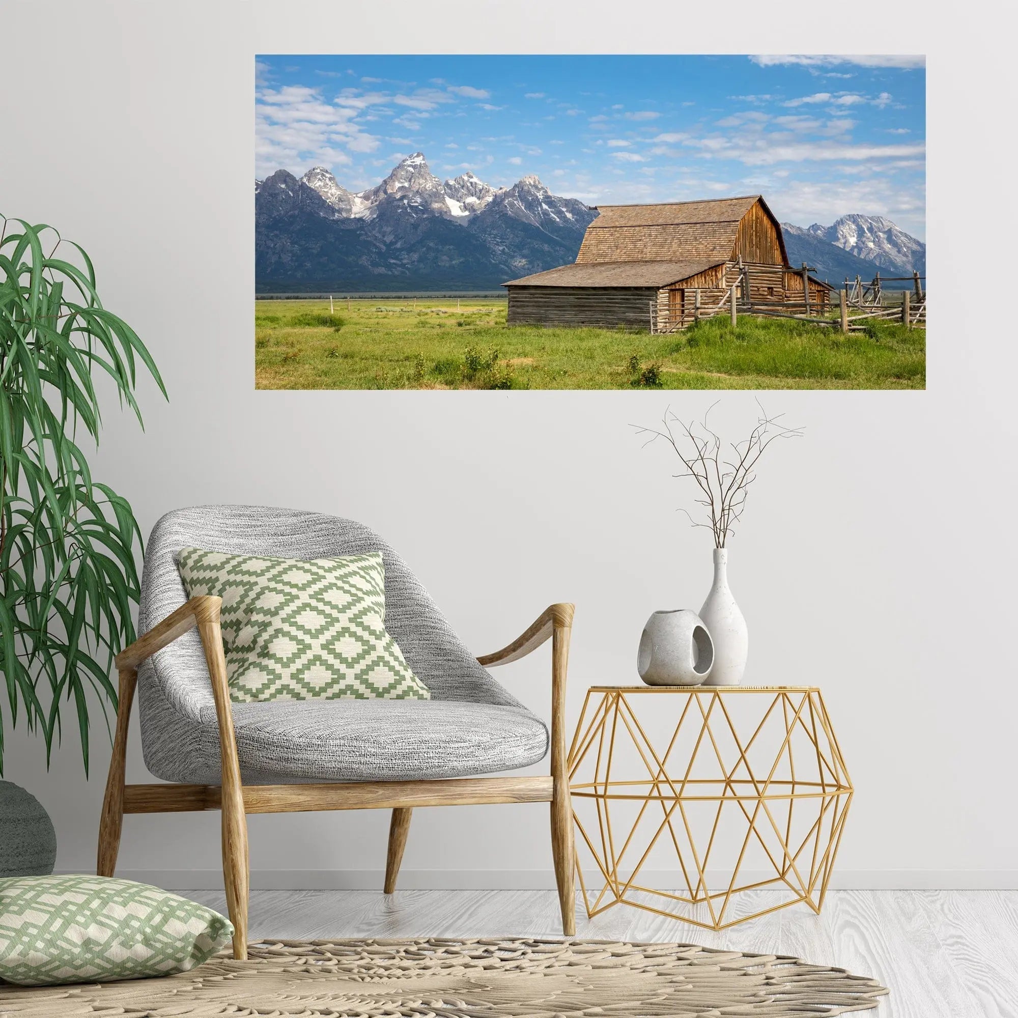 Art featuring John Molton barn art hanging on wall behind gray boho style chair