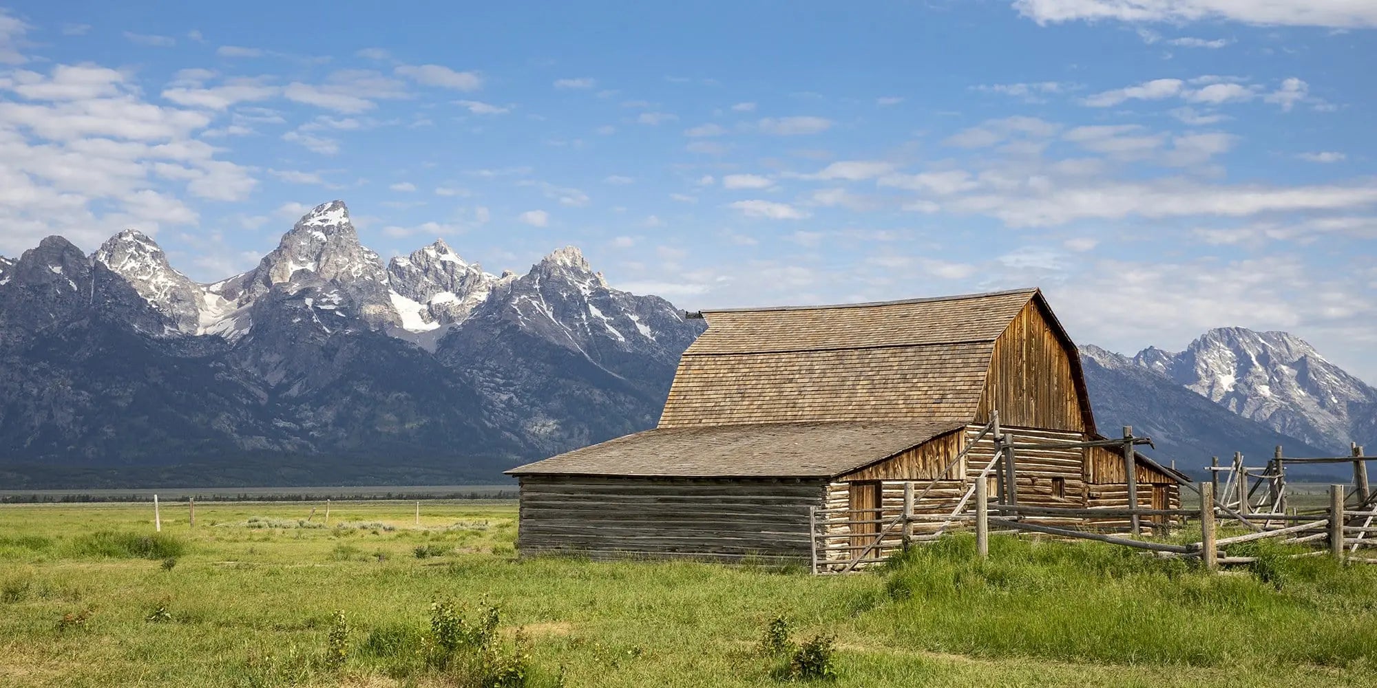 Fine art photography print of the T.A. Moulton Barn at Mormon Row with the Teton Range in the background, perfect for rustic home decor.