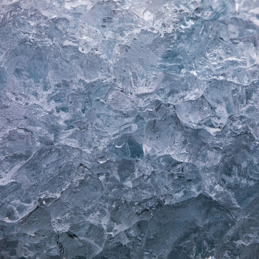 Close up photo of hundred year old iceberg crystals blue and white ice