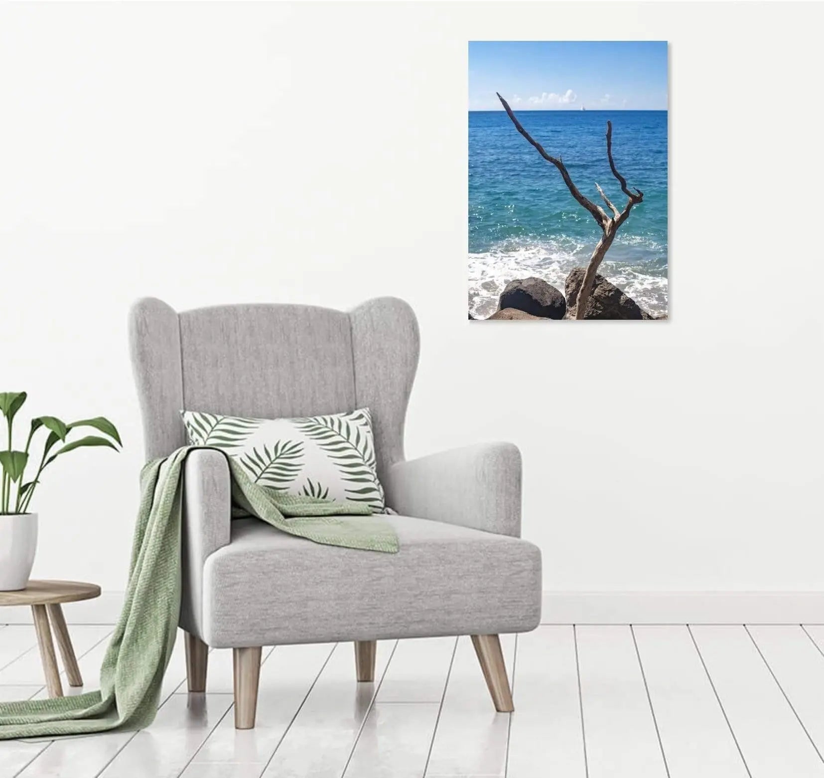 Comfy gray and white room featuring a Fine art print of aged wood and ocean waves – perfect for beach living spaces