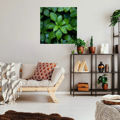 Green leafy raindrop art hanging on wall in simplistic living room