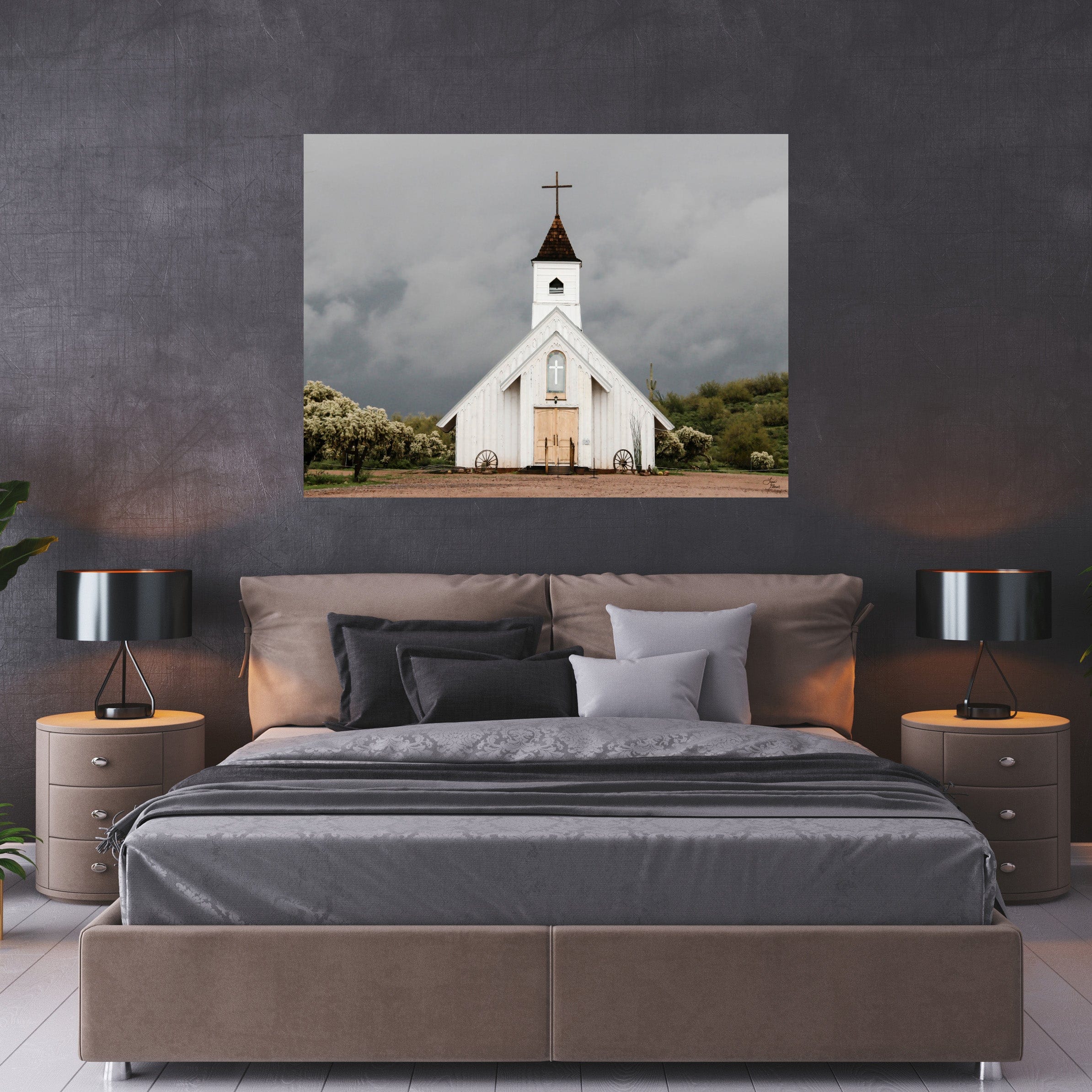 Rustic Arizona church wall art “Spiritual Warfare” centered above a modern gray bed in a moody, sophisticated bedroom.