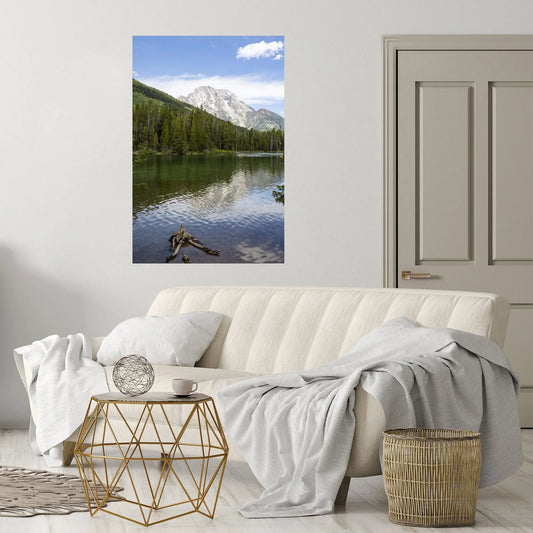 Colorful String Lake art hanging in a white and gray living room