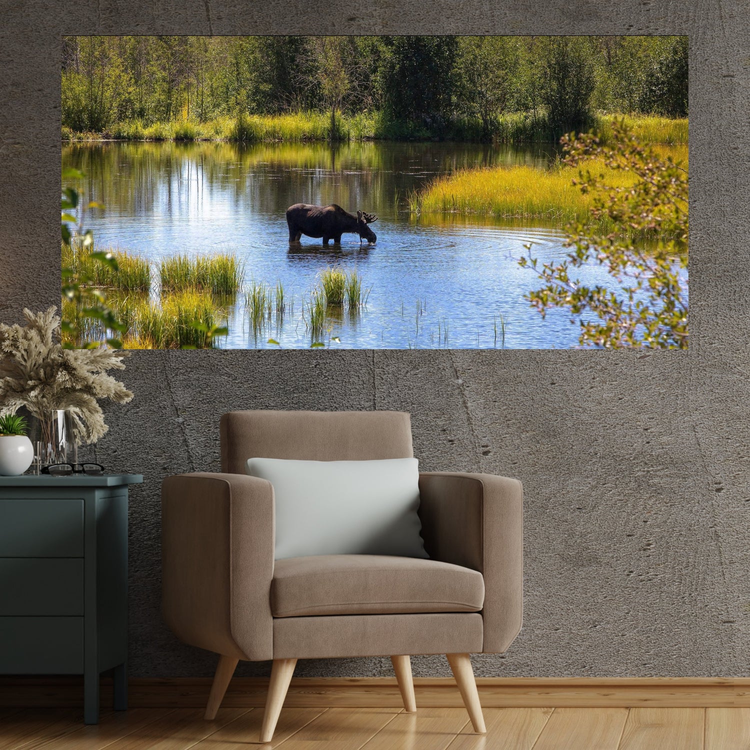 Large fine art of a moose drinking water in Wyoming from a marsh.  Art hanging on wall in a sitting area.