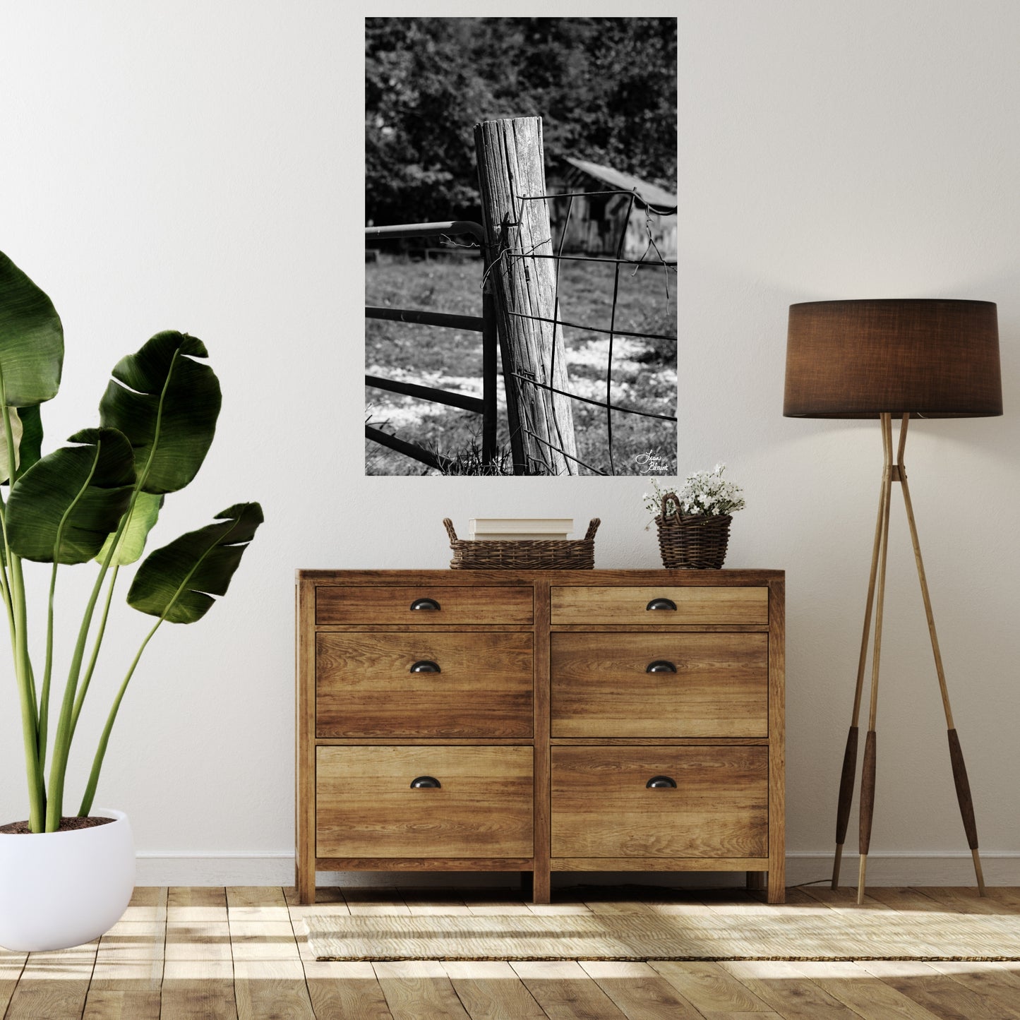 Rustic modern farmhouse room with picture of old fence post hanging above a cabinet