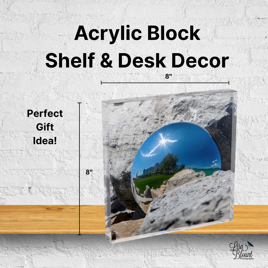 Acrylic block of Gazing Bay Harbor with reflection from a gazing ball with the hotel in the background - displayed on a shelf with size reference, showing scale and clarity of the miniature fine art piece