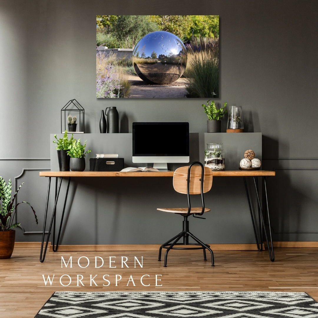 Hall Gazing Ball fine art print 30x20 displayed in a modern workspsace, adding a touch of nature-inspired beauty to the space.