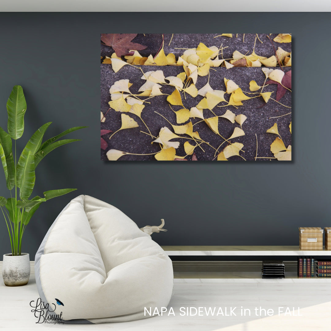 Yellow ginkgo leaves brushed metal fine art photography wall decor hanging in casual sitting area 