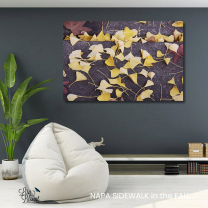 Yellow ginkgo leaves brushed metal fine art photography wall decor hanging in casual sitting area 