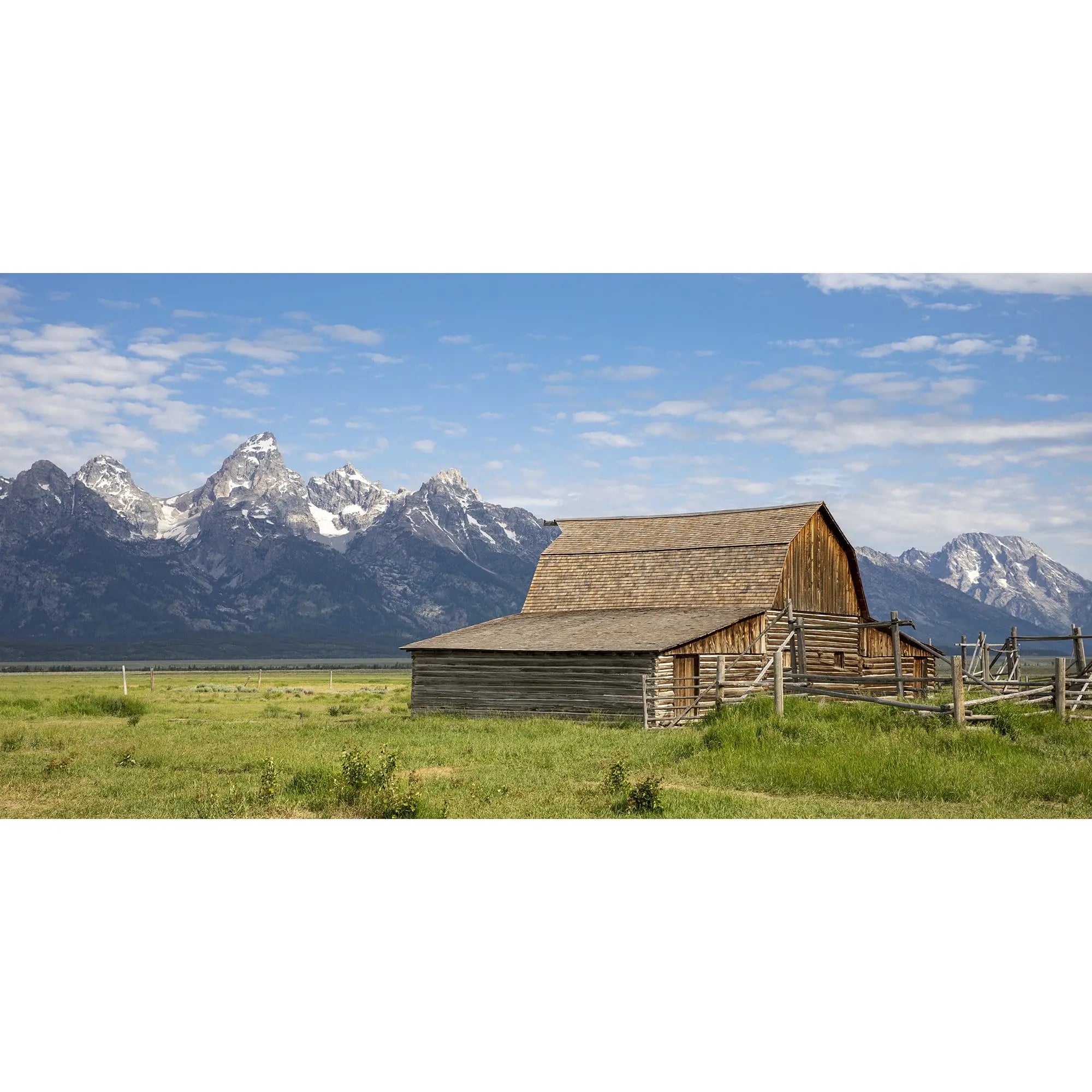 Fine art photography print of the John  Moulton Barn with the Teton Range in the background, perfect for rustic home decor.