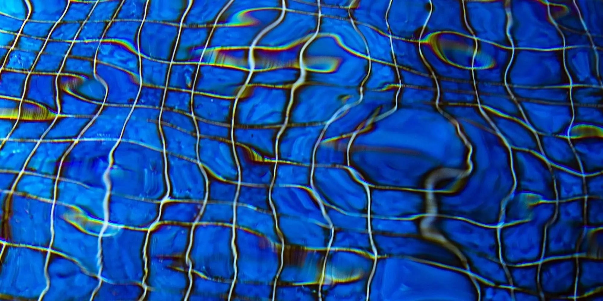 Abstract fine art photography of cobolt blue pool with rippling water – contemporary wall decor for modern spaces
