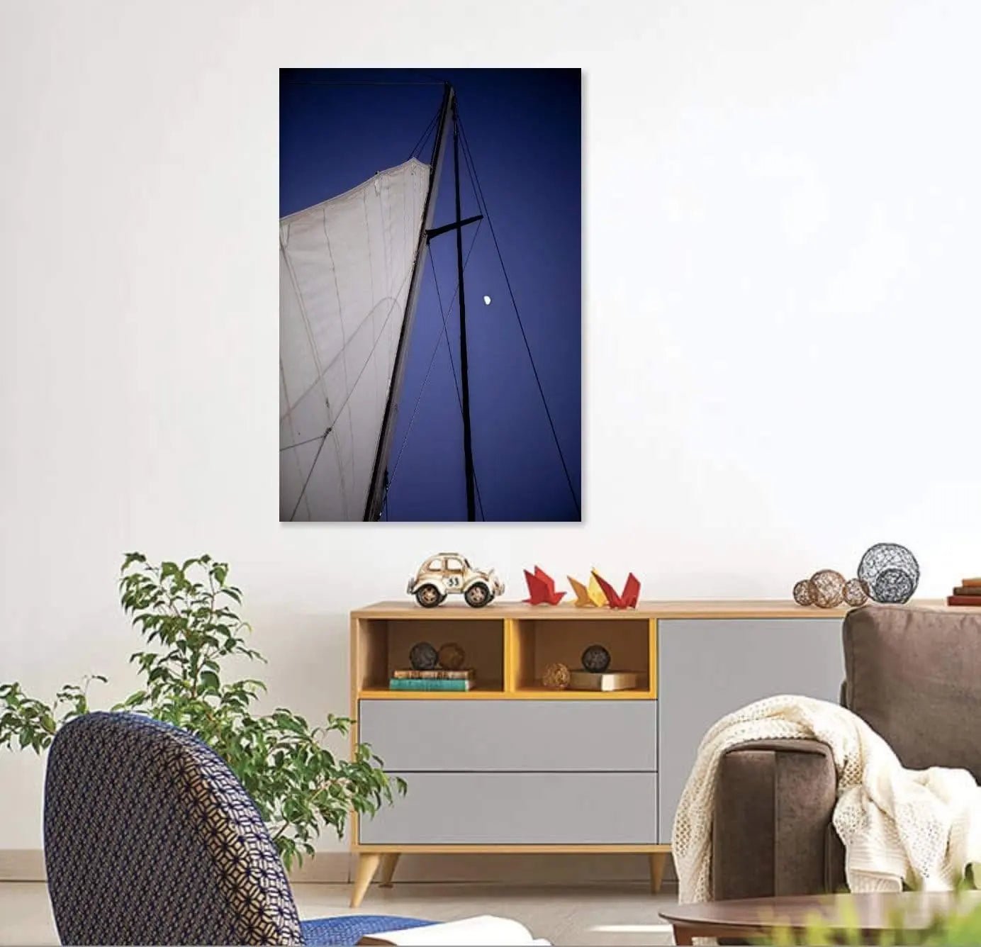 Sailing at night art displayed on wall in family room