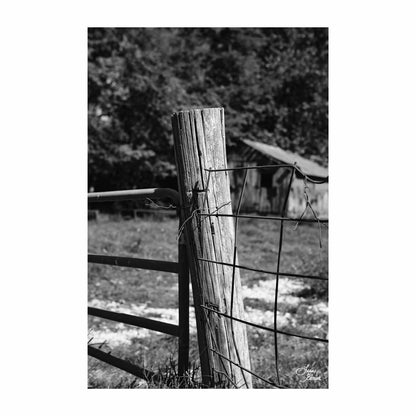 Country fence post holding up gate in black white rustic art photo by Lisa Blount Photography