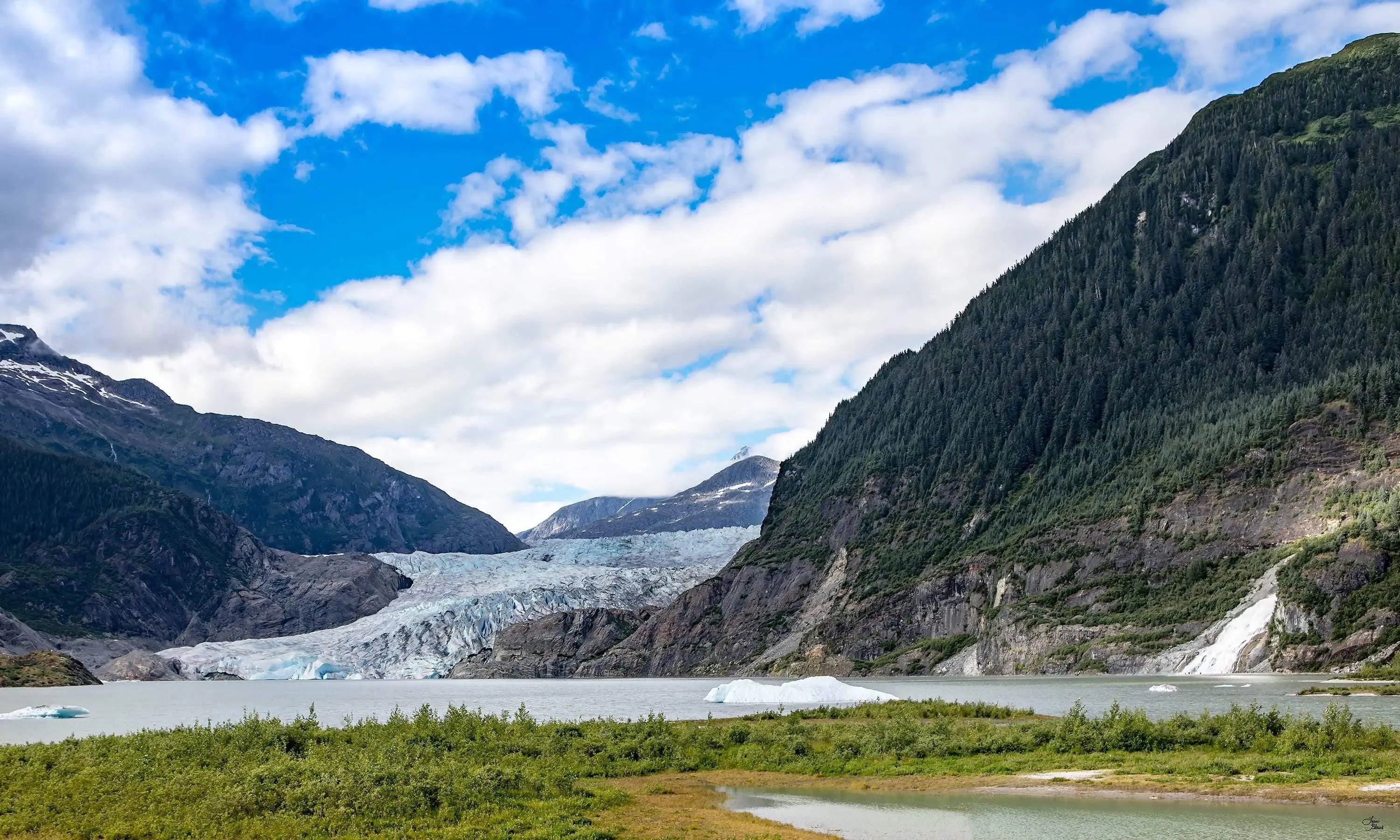 Fine art photo of Mendenhall Glacier in Juneau, Alaska featuring glacier-blue water, floating ice, Nugget Falls, and scenic mountain textures